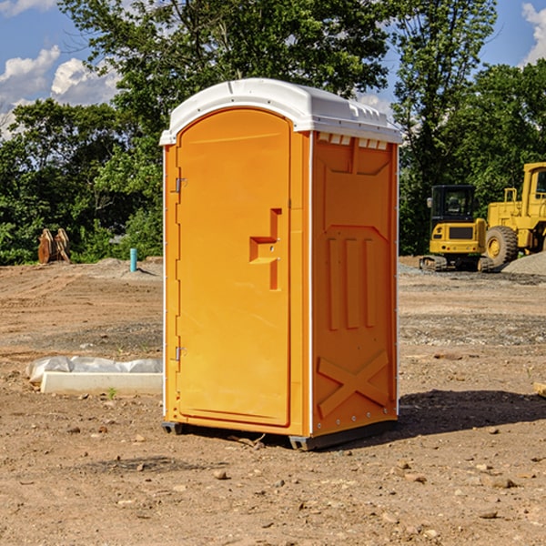 what is the cost difference between standard and deluxe portable restroom rentals in Catlin